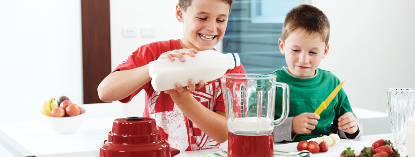 Two kids pouring milk for brekkie banner
